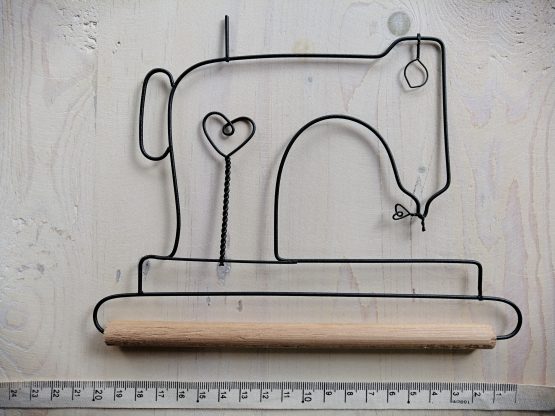 Gancho decorativo Maquina de coser con bolillo