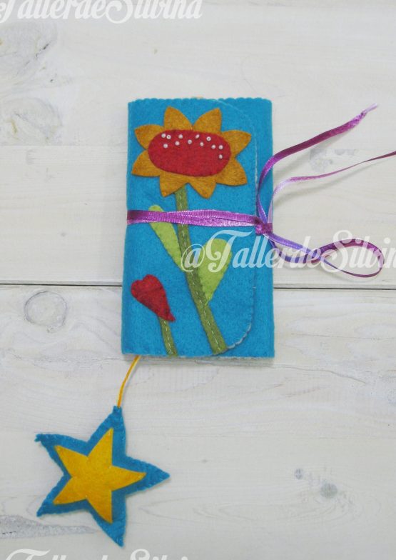 Alfiletero sobre flor y pajarito